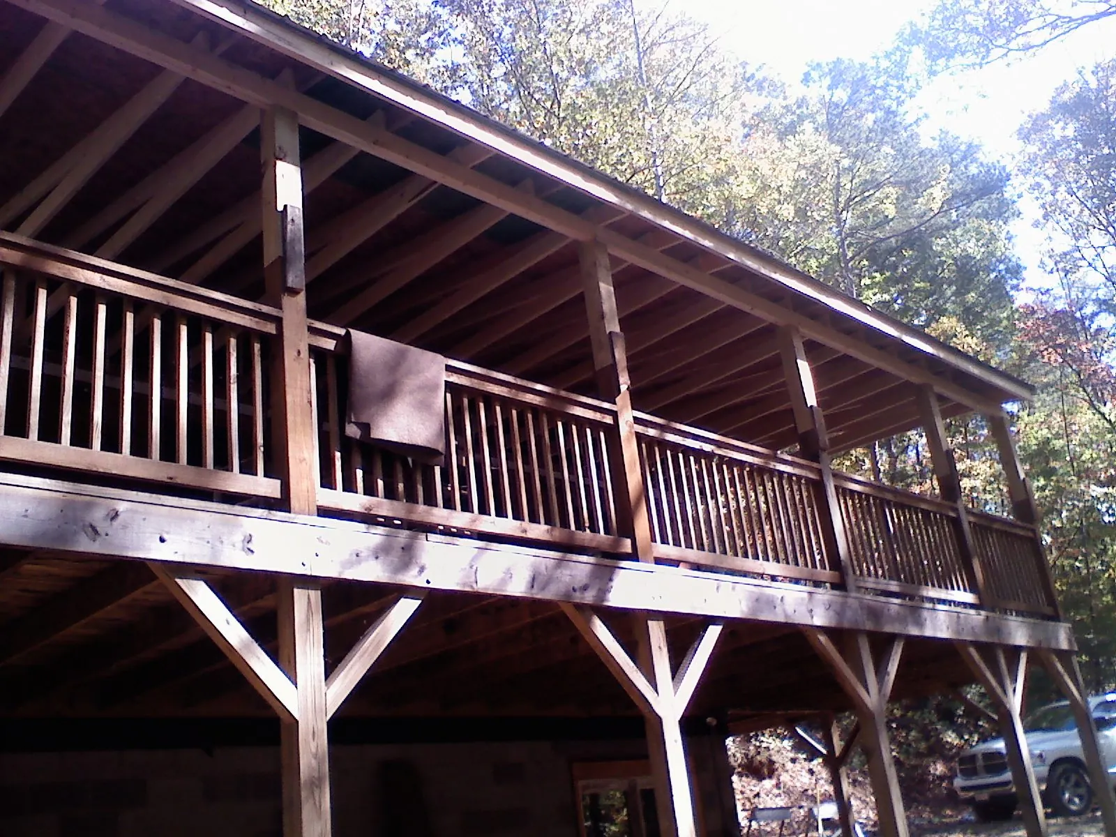 Timber framing under a new elevated porch and deck — Roof Leak Repair in West Creek by Roofing Brothers